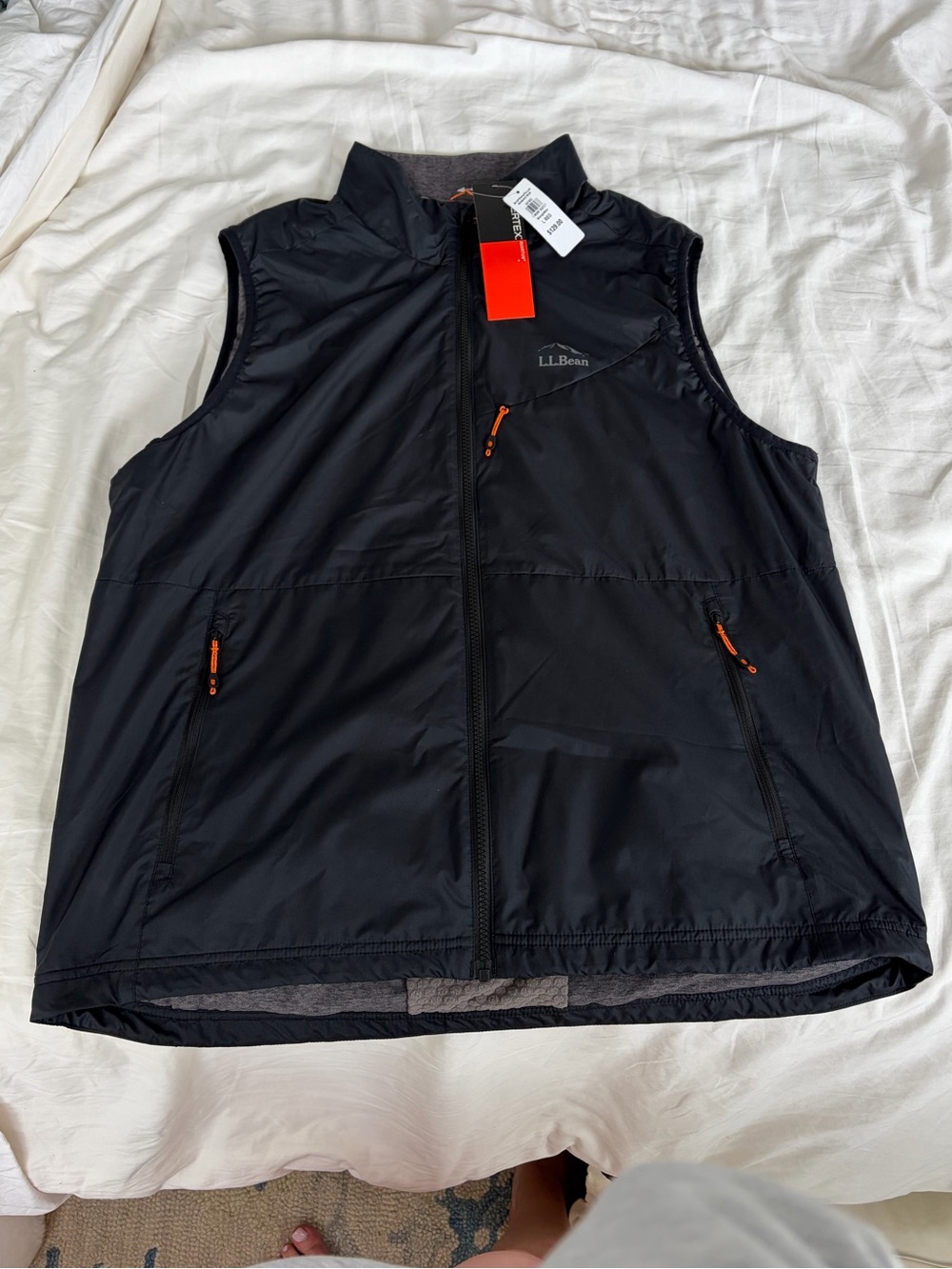 L.L. Bean Black Vest with Orange Pull Cord Detail